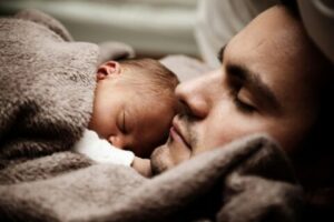 father holding baby