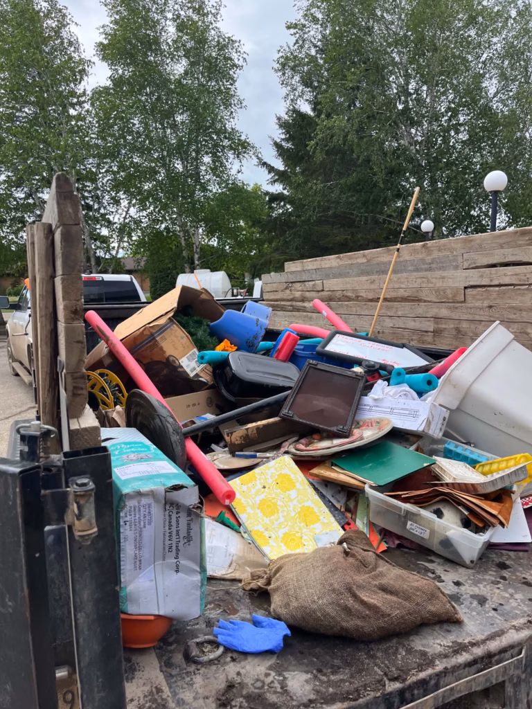 Water damaged items in a dumpster